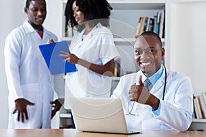 General practitioner with medical team at work