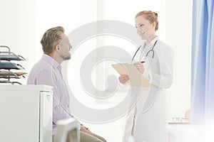 General practitioner talking to patient