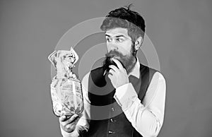 General savings tips. Man bearded hipster hold jar full of cash. Keeping cash issues. Businessman with his dollar