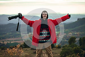 General shot of photographer smiling taking photos in nature