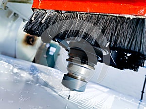 General view of a factory CNC machine cutting through Polyethylene