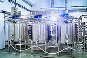 General view of the interior of a milk factory. Equipment at dairy plant.