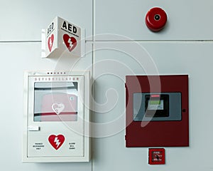 Portable automated external defibrillator AED and fire alarm system photo