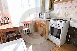 General view of an old kitchen unit in the interior of a kitchen in need of repair