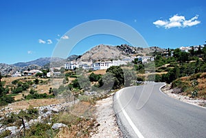 Country road and white town, Benaocaz, Spain. photo