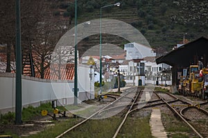 General view at the train station on Pinhao city with different lines, vineyards on background photo