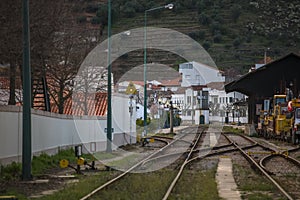 General view at the train station on Pinhao city with different lines, vineyards on background