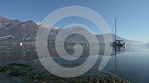 A general view of the tranquil waters and surrounding mountains in Oliveto Lario, Lake of Como, Lombardy, Italy.