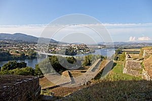 General view of ValenÃÂ§a do MiÃÂ±o in Portugal, the river MiÃÂ±o and Tui in Spain photo