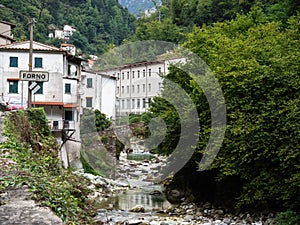 General view of the village of Forno in Massa Carrara province, Italy. Featuring ancient bridge. Still remembered as photo