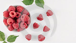 Top view of fresh ripe raspberries on white background with copy space