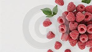 Top view of fresh ripe raspberries on white background with copy space