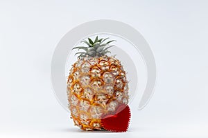 Azorean Pineapple (Ananas) with red heart on white background. Valentines day concept. Azores typical fruit. photo