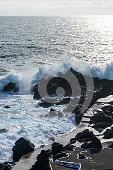 Powerful waves crash along the shoreline of Cinco Ribeiras.