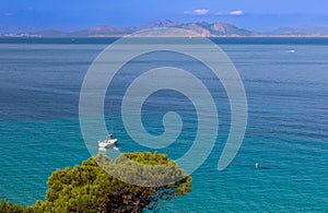 Sailing boat in the bay of Es Calo, Mallorca photo