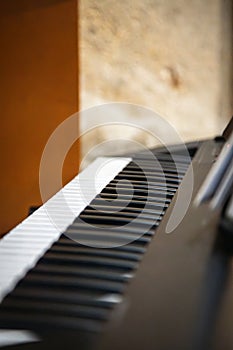 Close up of piano keys. Piano keyboard detail. Vertical background image photo