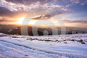 Winter\'s Glow: Sunset over Snowy Carpathian Slopes of Rarau photo