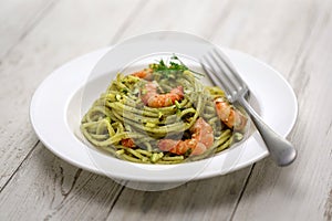 Sicilian pasta with pistachio pesto and shrimp photo