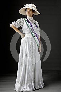 United Kingdom Victorian or Edwardian Suffragette with historically accurate sash and rosette photo