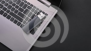 Modern Technology: Laptop with External USB Memory Disk â A Minimalist Setup