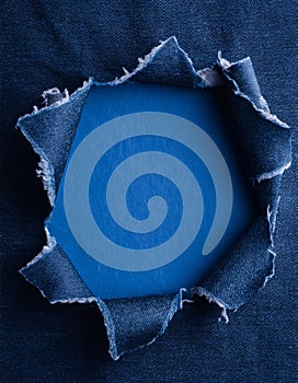 a piece of blue jeans material torn in the middle for text