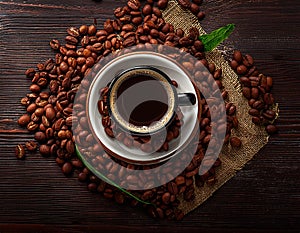 Arrangement of coffee beans and coffee cup with space for copy. photo