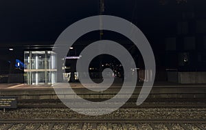 A nighttime photo of BrÃ¼nnen Westside train station.
