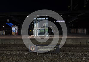 A nighttime photo of BrÃ¼nnen Westside train station.