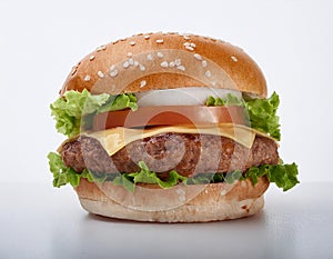 Juicy burger. Big and Juicy cheese burger on a white background