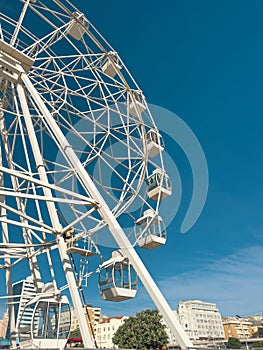 Generated imageWhite ferris wheel against a clear blue sky in Figueira da Foz.