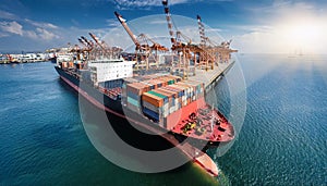 Container ship in port terminal - huge freighter fully loaded