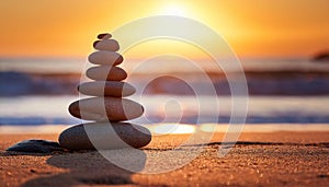 Stones pyramid on sand symbolizing harmony.