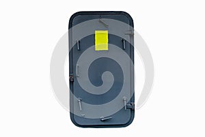 Black metal door thick and strong is closing entrance and exit to room on container vessel.