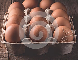 Carton of fresh brown eggs