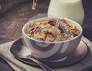 Breakfast cereal. Milk and fruit musli in a bowl
