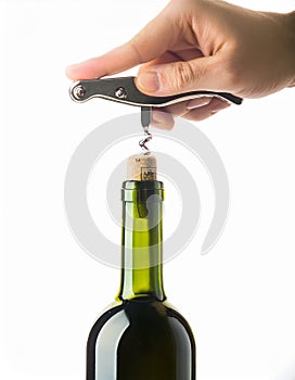 Opening a wine bottle with corkscrew, isolated on white