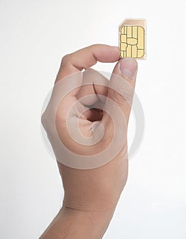 Sim card In a hand isolated on white background