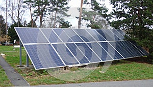 Energy park. Solar panel and eolic system on green park