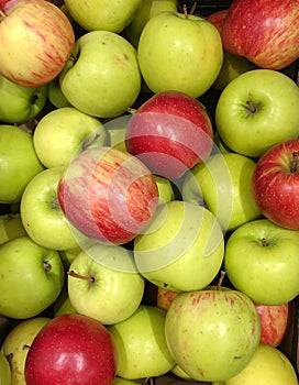 Fresh ripe green and red apples as background, top view