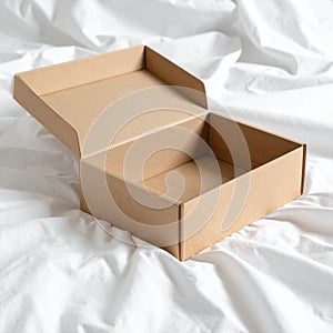 Open Cardboard Box on White Fabric