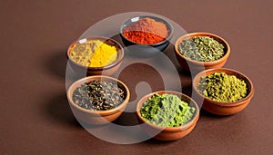 Matte Deep Brown Surface with Colorful Powdered Herbs in Small Bowls Arranged in Circle