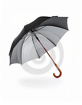 Open umbrella blown by wind gust on white background