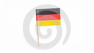 Small paper flag of Germany isolated on white