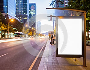 Blank Billboard at Night Bus Stop