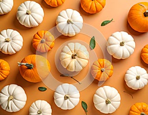 Flat lay composition with different ripe pumpkins on orange background