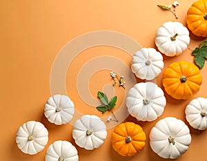 Flat lay composition with different ripe pumpkins on orange background