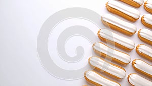Ãclairs arranged neatly on matte soft white gradient background