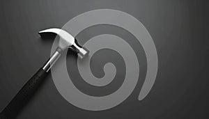 Dark matte background with single hammer in bottom-left corner