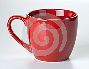 Empty red ceramic mug isolated on white