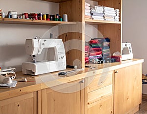 Colorful Sewing Workshop with Fabrics and Sewing Machine.
